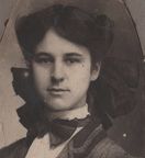 unknown woman in tailored jacket and big bows - cropped