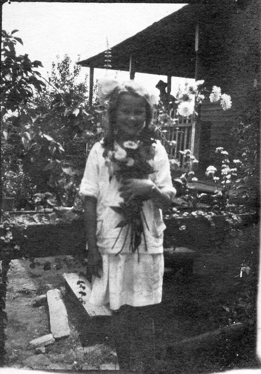 Catherine Brantley as a girl with flowers